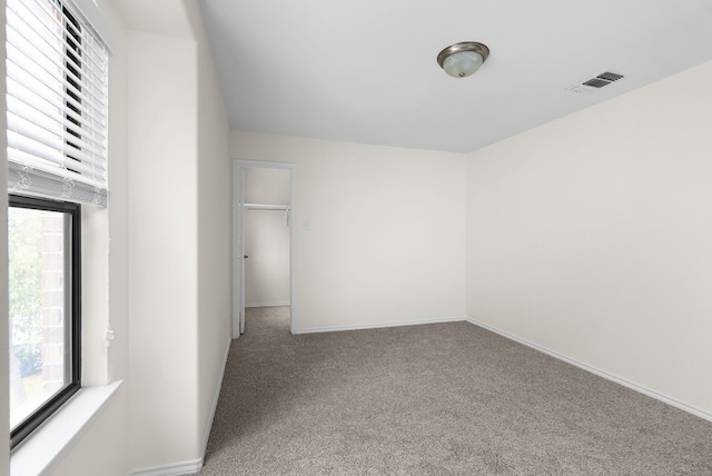 unfurnished room with carpet