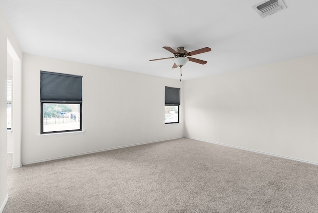 unfurnished room with carpet flooring and ceiling fan