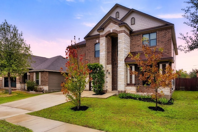 view of front of property with a yard