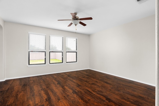 unfurnished room featuring dark hardwood / wood-style flooring and ceiling fan