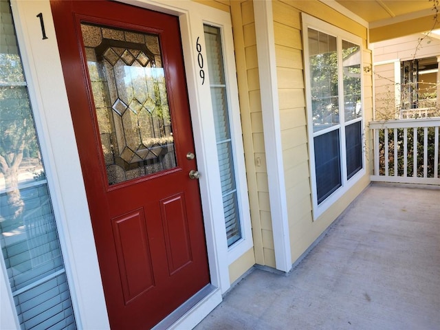 doorway to property featuring covered porch