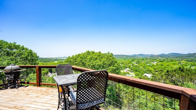 wooden terrace with a mountain view and grilling area