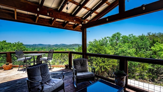 wooden deck featuring a mountain view