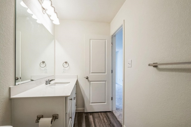 bathroom featuring vanity and wood-type flooring