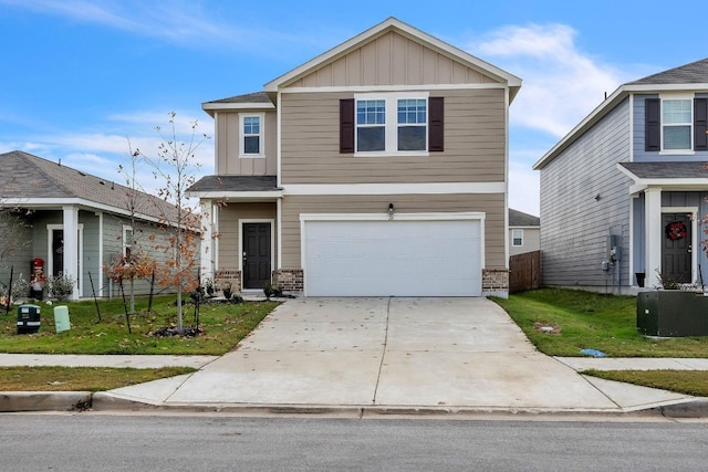 view of front of property featuring a front yard, a garage, and cooling unit