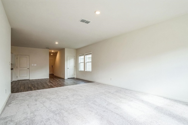 empty room featuring dark hardwood / wood-style flooring