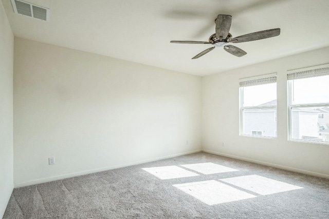 unfurnished room with light carpet and ceiling fan