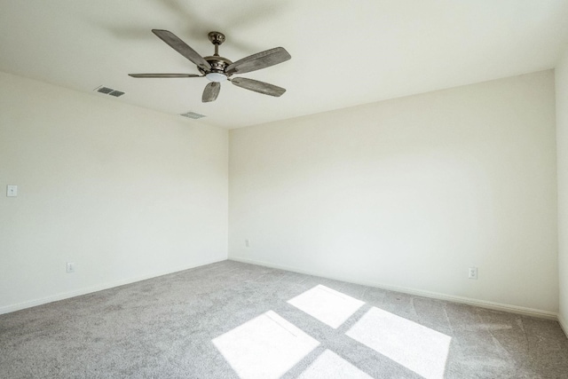 carpeted empty room with ceiling fan