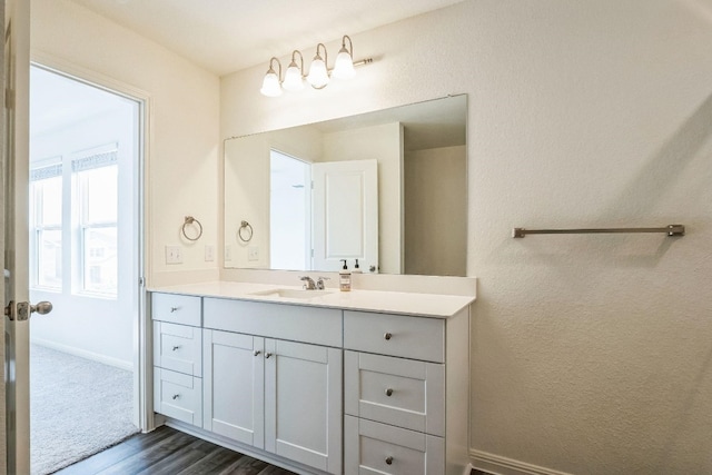 bathroom with vanity and hardwood / wood-style flooring