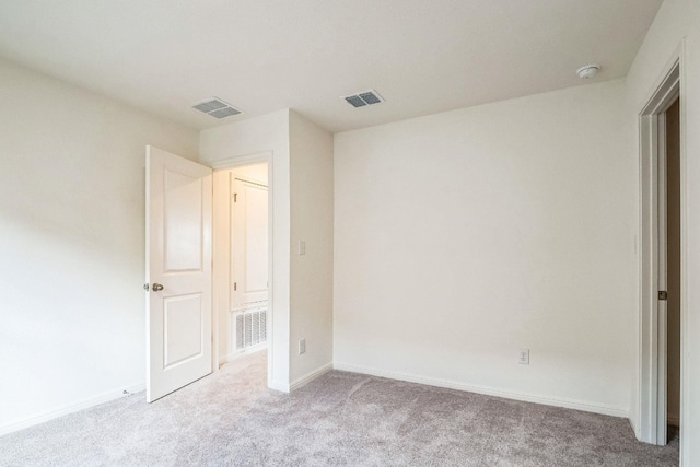 unfurnished bedroom with light colored carpet