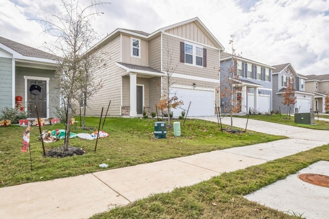 view of front of property with a garage and a front lawn