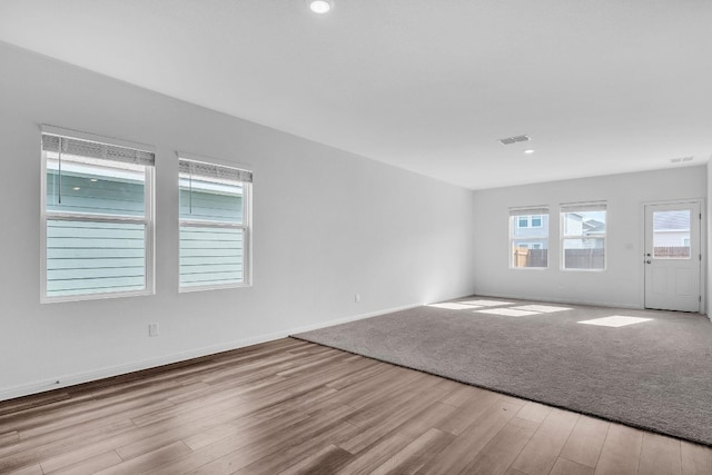 unfurnished room featuring light hardwood / wood-style floors