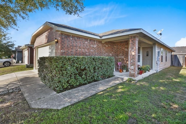 view of side of property with a garage and a lawn