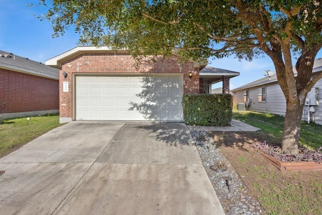 ranch-style home with a garage, concrete driveway, and brick siding