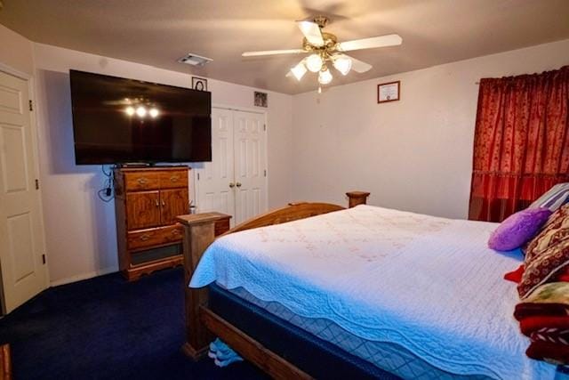 carpeted bedroom with a closet and ceiling fan