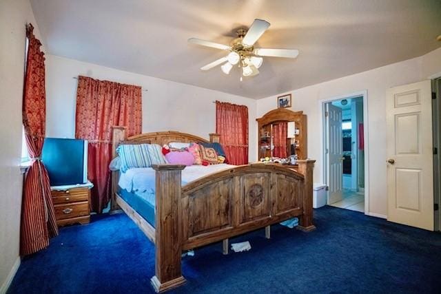 carpeted bedroom featuring ceiling fan and ensuite bathroom