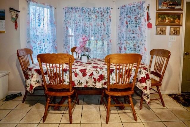 dining area featuring tile patterned flooring