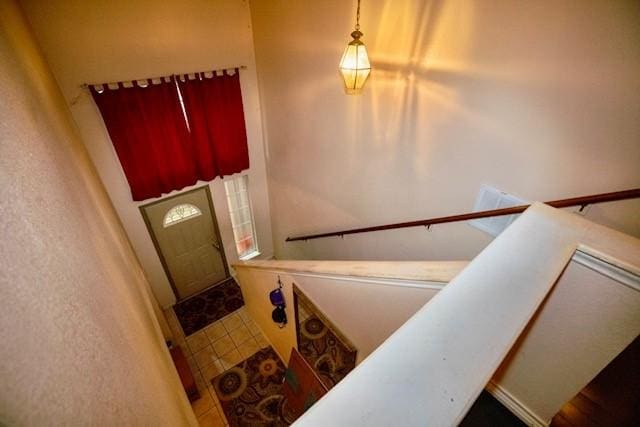 stairway featuring tile patterned floors