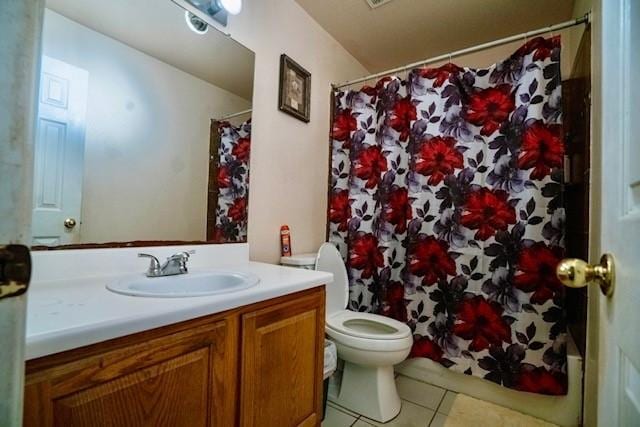 bathroom with tile patterned floors, vanity, toilet, and a shower with shower curtain