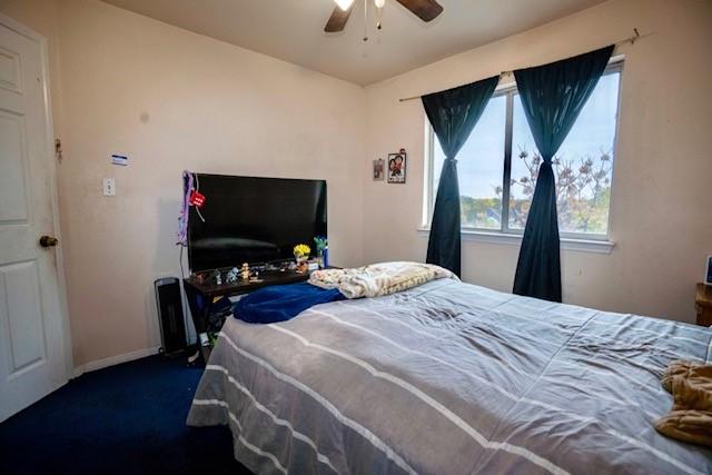 carpeted bedroom with ceiling fan