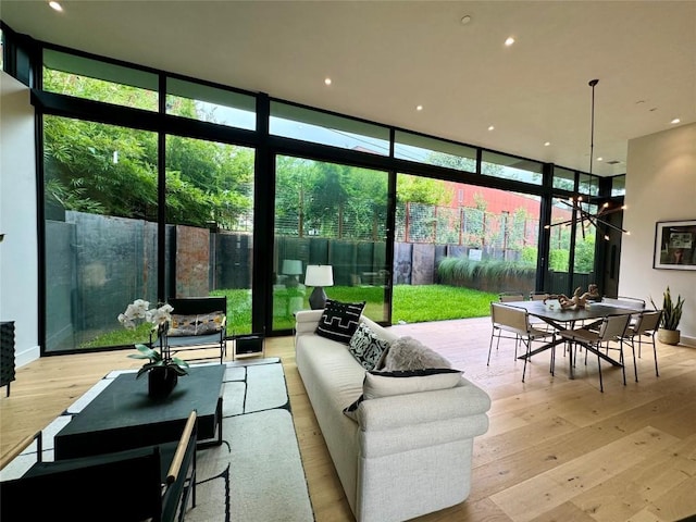 sunroom featuring an inviting chandelier