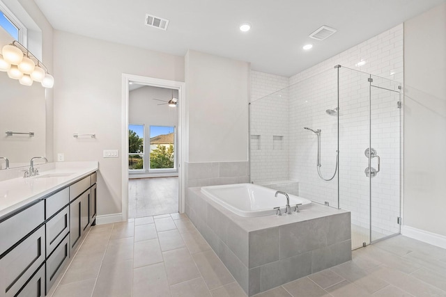 bathroom featuring tile patterned floors, ceiling fan, plus walk in shower, and vanity