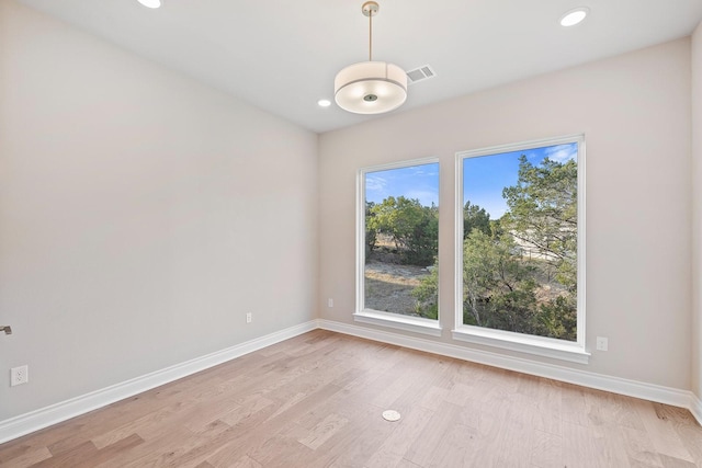 unfurnished room with light wood-type flooring