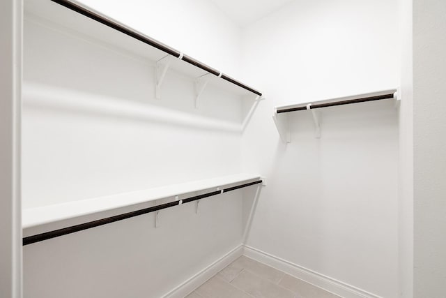 walk in closet featuring light tile patterned floors