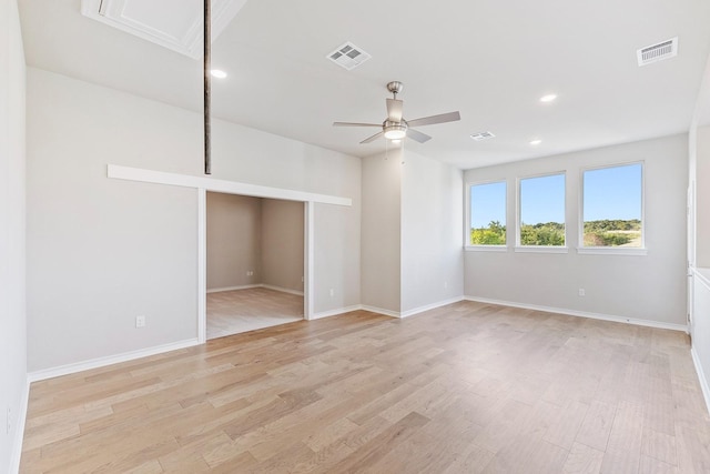 unfurnished room with light hardwood / wood-style floors and ceiling fan