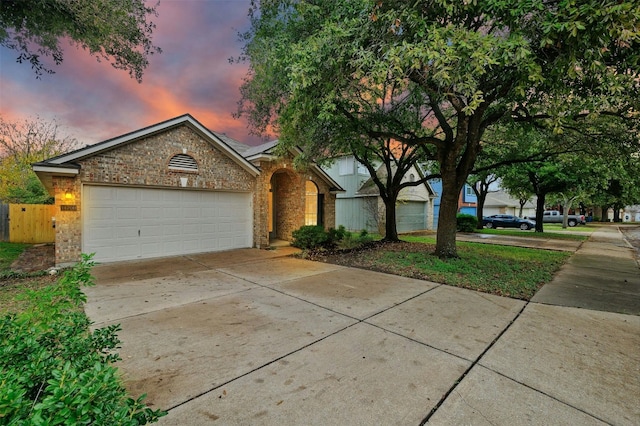 single story home with a garage