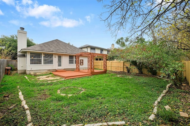 back of property with a lawn and a wooden deck