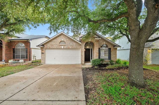 single story home featuring a garage