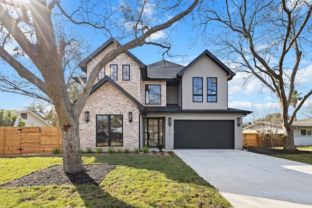 view of front of home with a front lawn and a garage