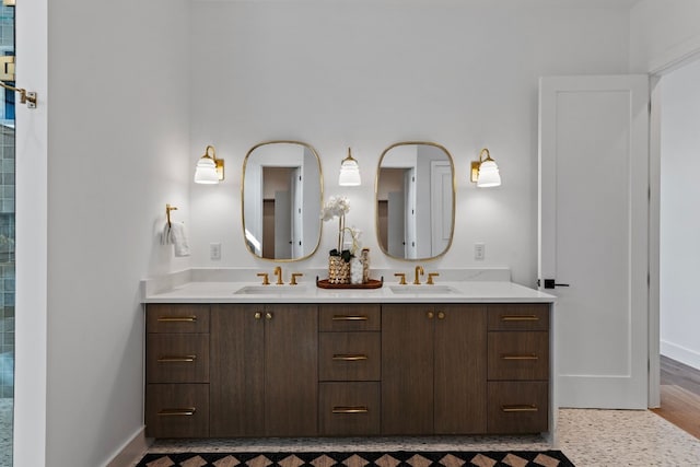 bathroom with vanity and hardwood / wood-style flooring