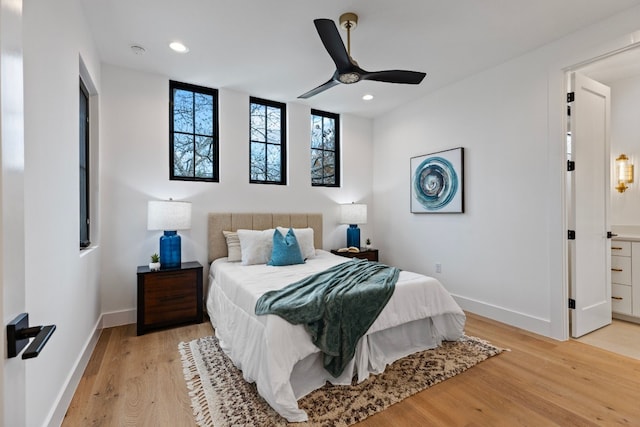 bedroom with light wood-type flooring and ceiling fan