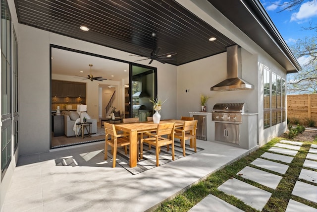 view of patio / terrace with an outdoor kitchen, ceiling fan, and grilling area