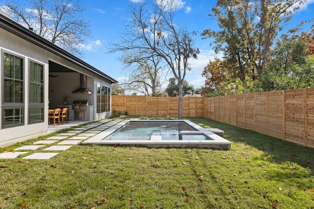 exterior space featuring a fenced in pool, area for grilling, and a patio area