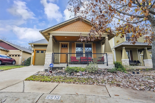 craftsman house with a garage and covered porch