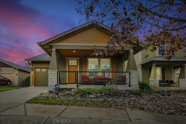 craftsman-style home featuring a garage and covered porch