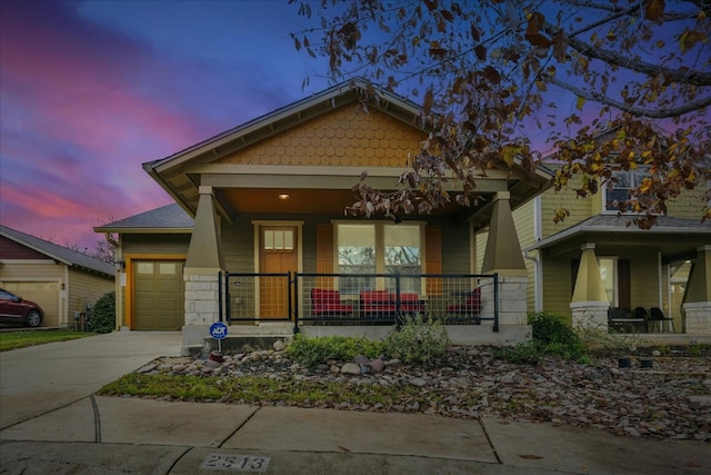 craftsman inspired home with a porch and a garage