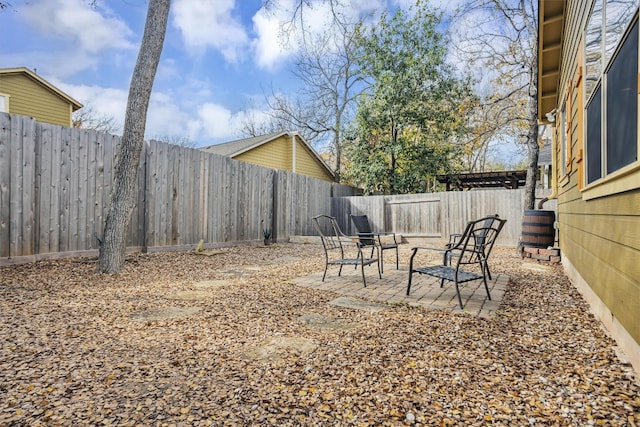 view of yard featuring a patio and a fenced backyard