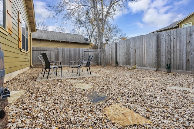 view of yard featuring a fenced backyard and a patio