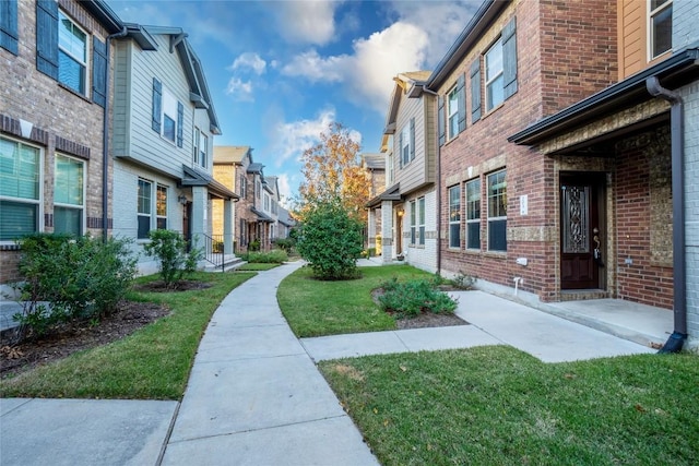 surrounding community featuring a lawn