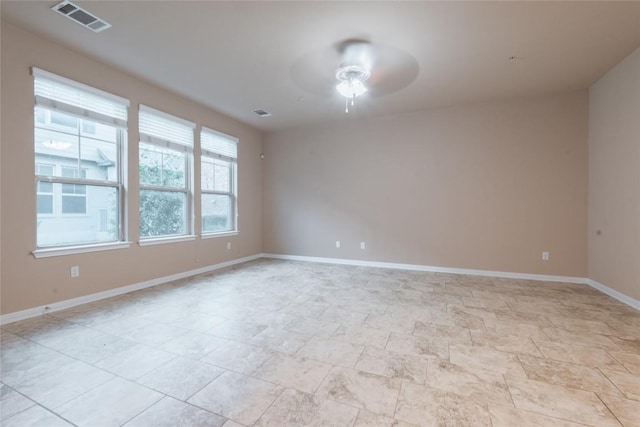 empty room featuring ceiling fan