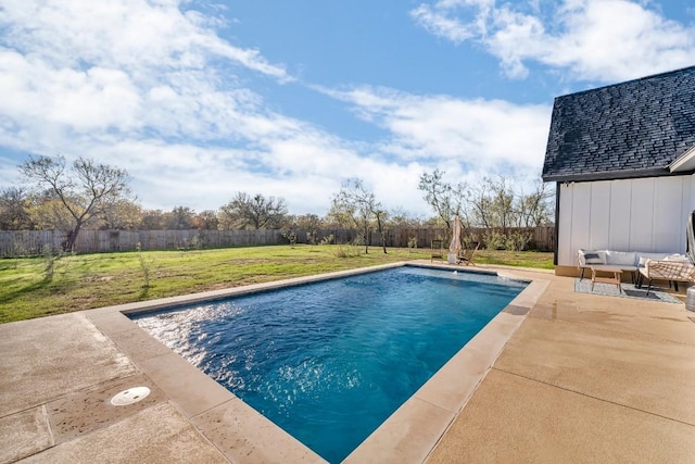 view of swimming pool featuring outdoor lounge area, a yard, and a patio