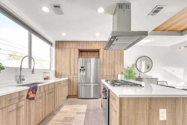 kitchen featuring a spacious island, stainless steel appliances, sink, and island range hood