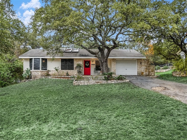 ranch-style house with a front yard and a garage