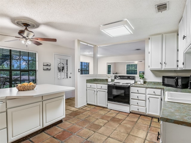 kitchen featuring a textured ceiling, ceiling fan, sink, electric range, and white cabinetry