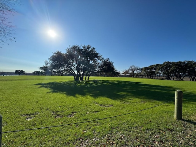 view of property's community with a lawn