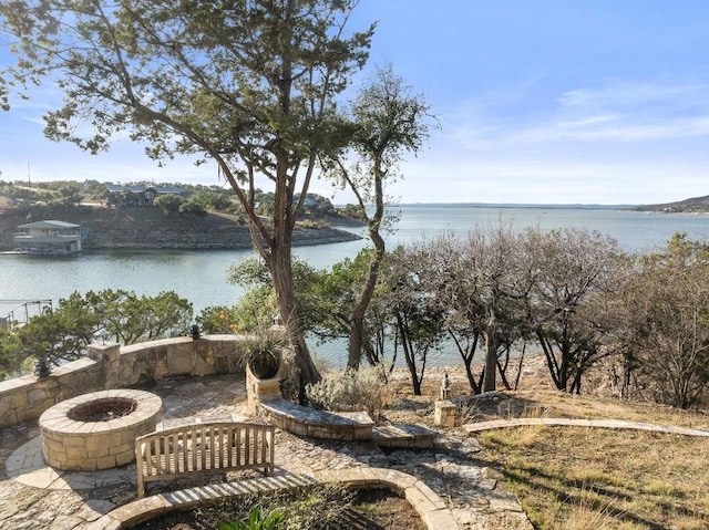 water view featuring an outdoor fire pit